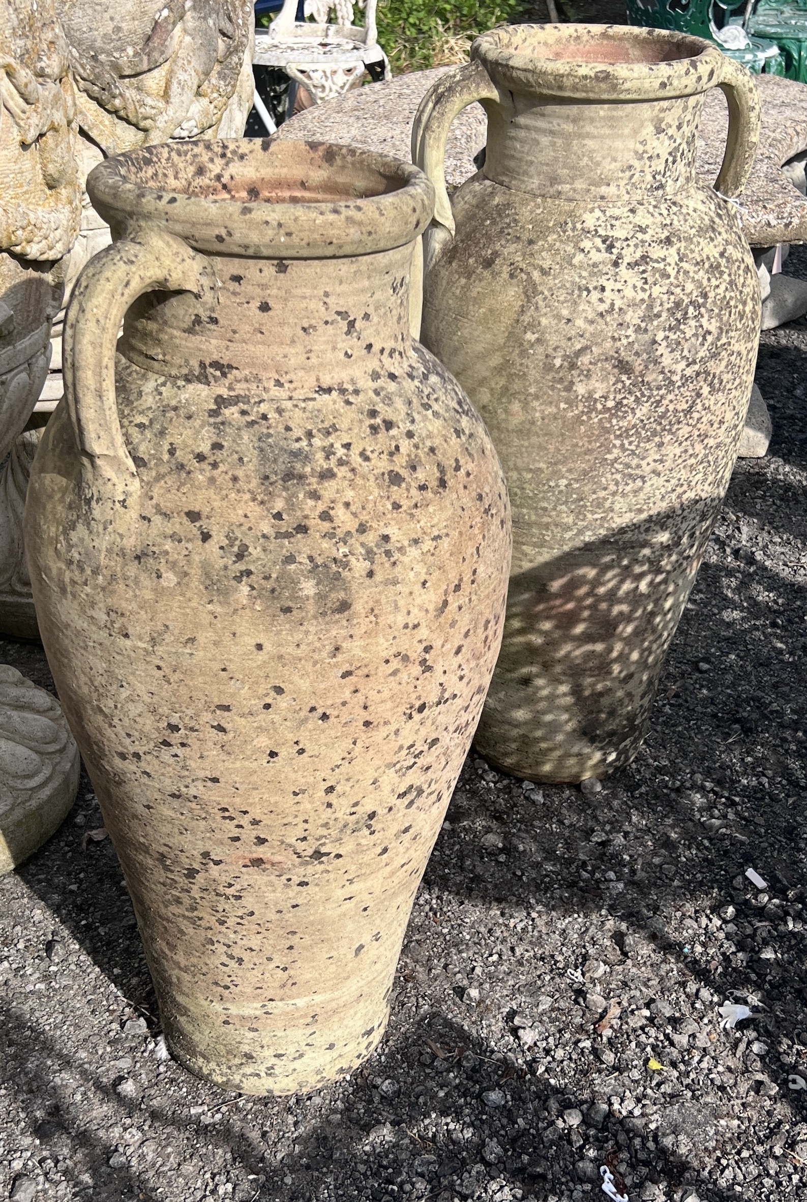 A near pair of earthenware amphora garden ornaments, tallest 80cm